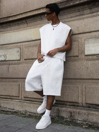 Textured white sleeveless top and matching shorts worn with white sneakers